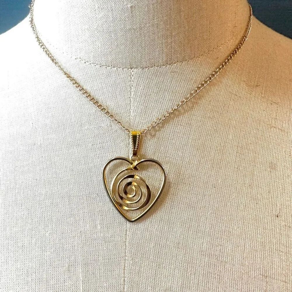 Gold tone heart swirl pendant necklace